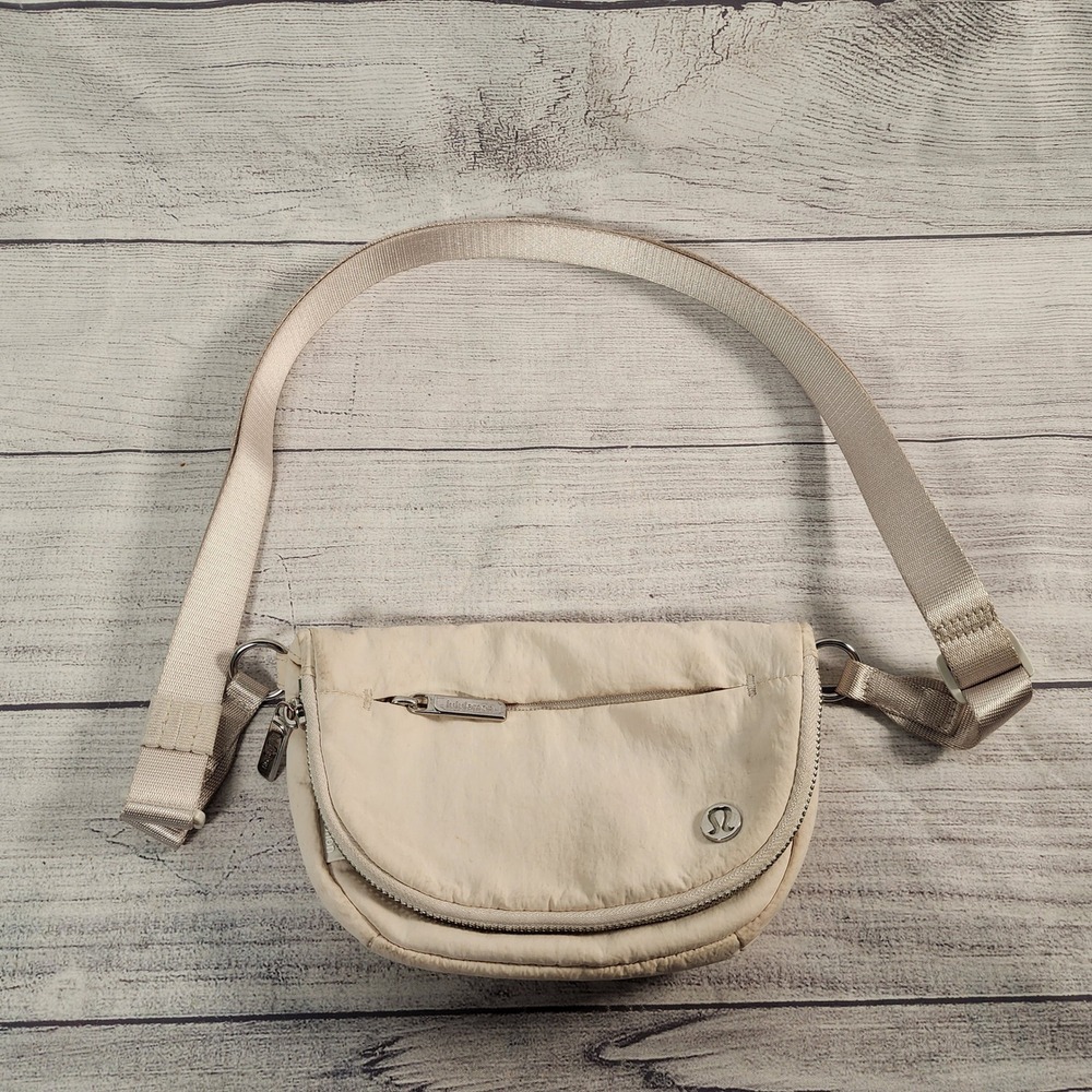 Lululemon Cream Nylon Crossbody Bag Adjustable Strap Curved Sporty Messenger